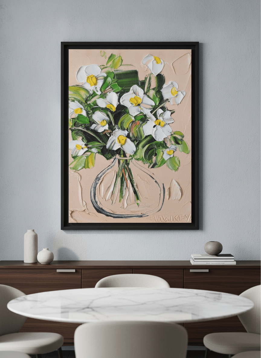 Wall art styled above a dining table in a contemporary home