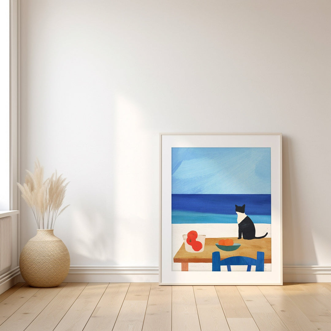 Artwork of a cat at a table by the sea on a white wall.