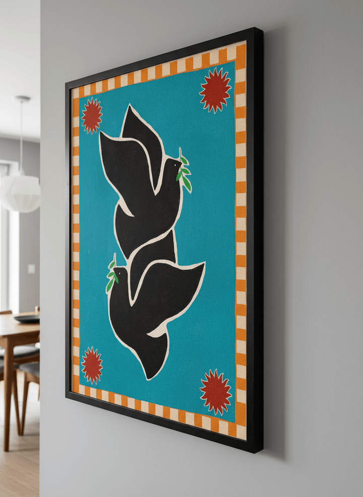 Wall art styled above a dining table in a contemporary home