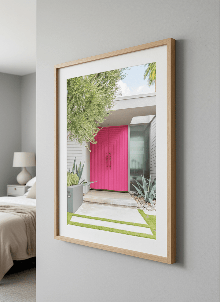 Minimalist artwork displayed in a calm, light-filled bedroom interior