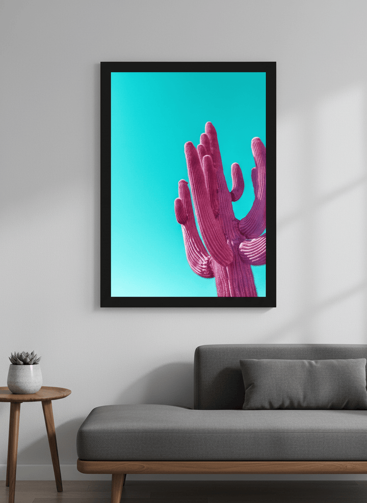 Modern wall art styled above a sofa in a neutral living room