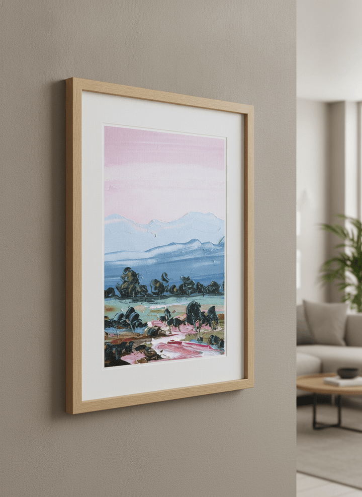 Modern wall art styled above a sofa in a neutral living room