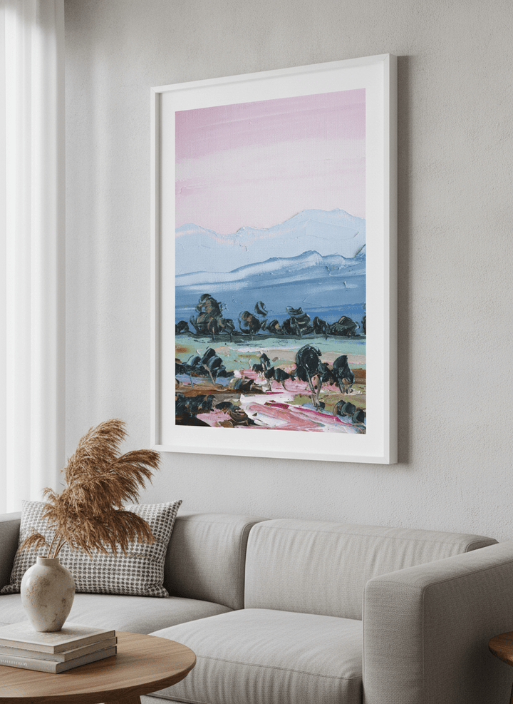 Modern wall art styled above a sofa in a neutral living room