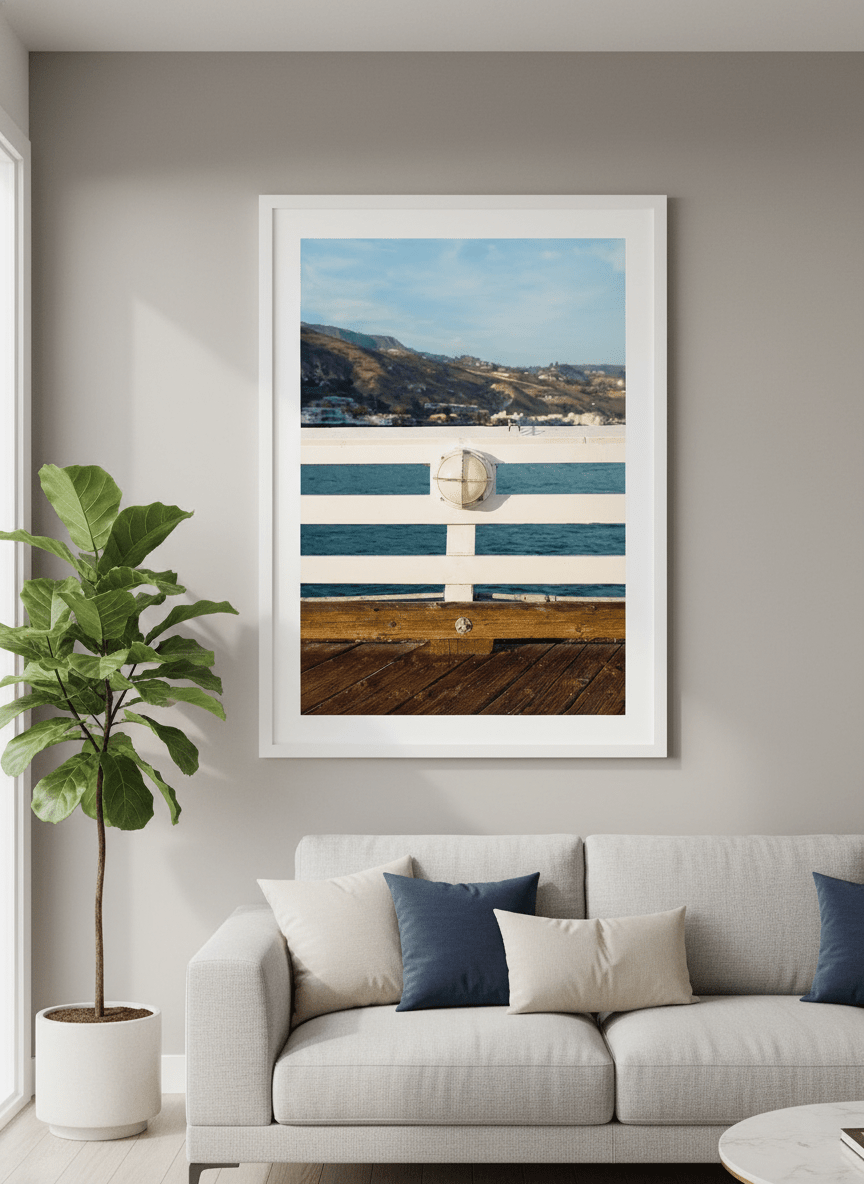 Modern wall art styled above a sofa in a neutral living room
