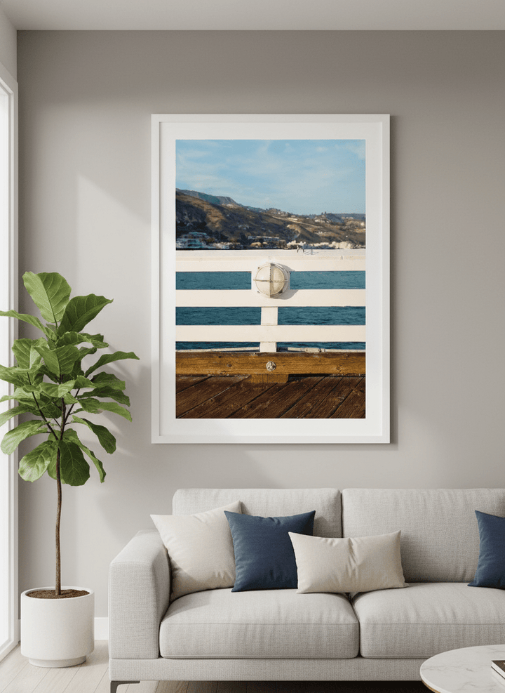 Modern wall art styled above a sofa in a neutral living room