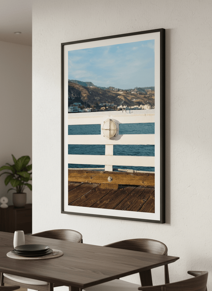 Wall art styled above a dining table in a contemporary home