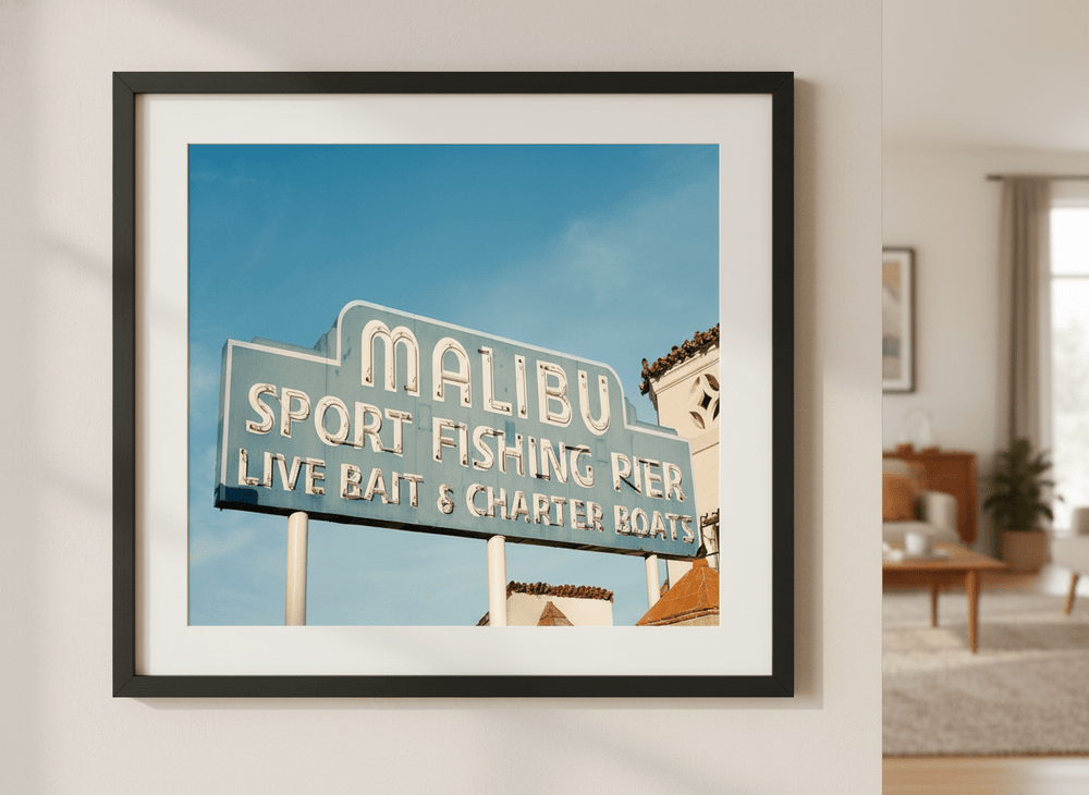 Modern wall art styled above a sofa in a neutral living room