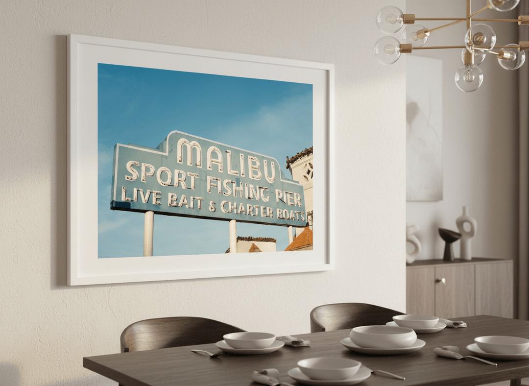 Wall art styled above a dining table in a contemporary home