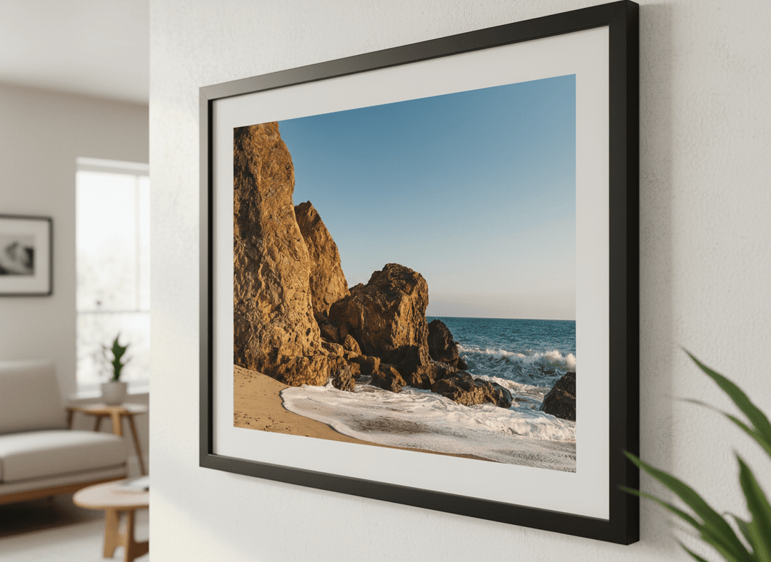 Modern wall art styled above a sofa in a neutral living room