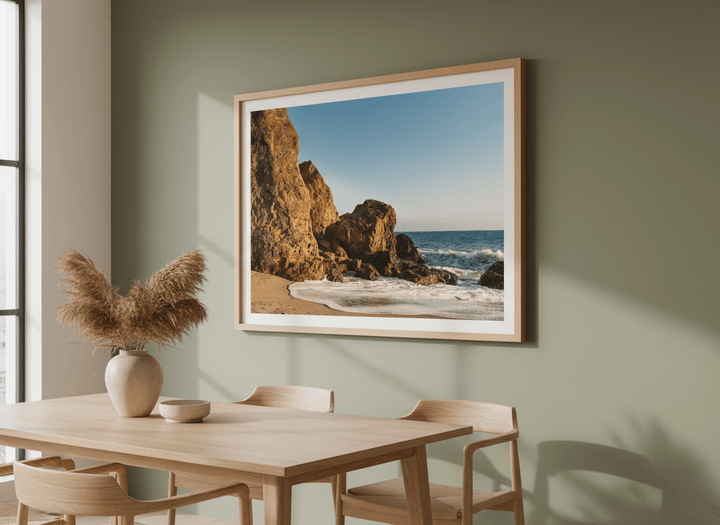 Wall art styled above a dining table in a contemporary home