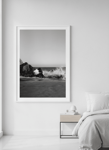 Minimalist artwork displayed in a calm, light-filled bedroom interior