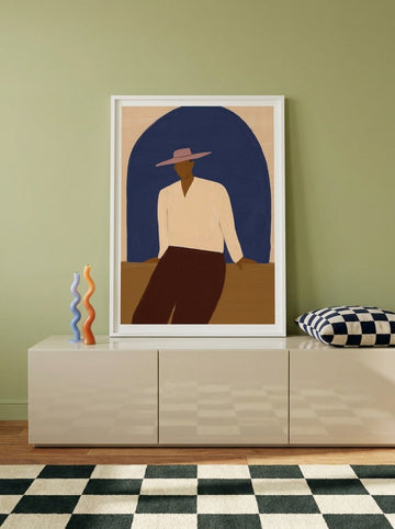 Modern wall art print standing on a sideboard in a colourful eclectic home office