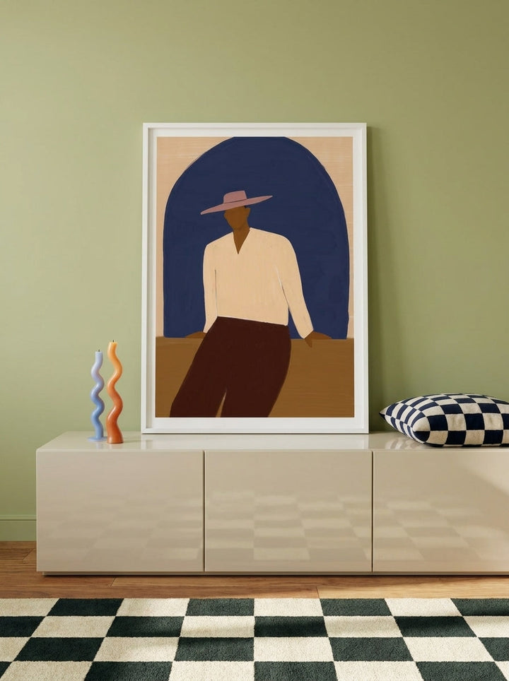 Modern wall art print standing on a sideboard in a colourful eclectic home office
