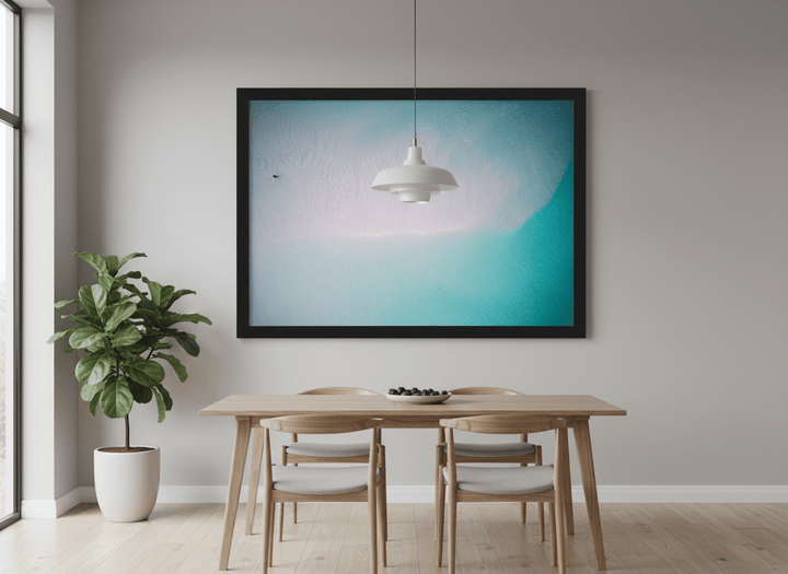 Wall art styled above a dining table in a contemporary home