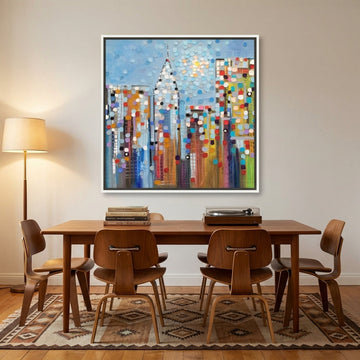 Canvas wall art with a white surround styled on the wall in a mid-century dining room