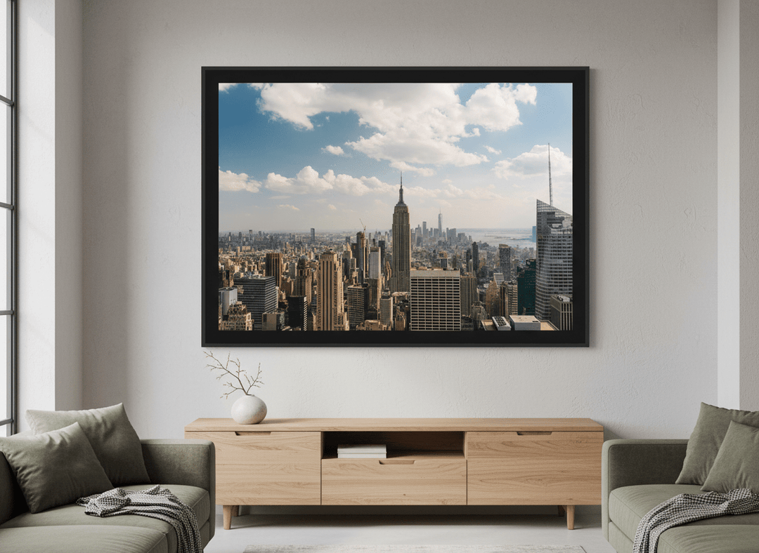 Modern wall art styled above a sofa in a neutral living room