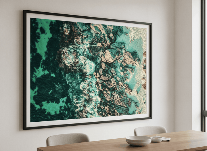 Wall art styled above a dining table in a contemporary home