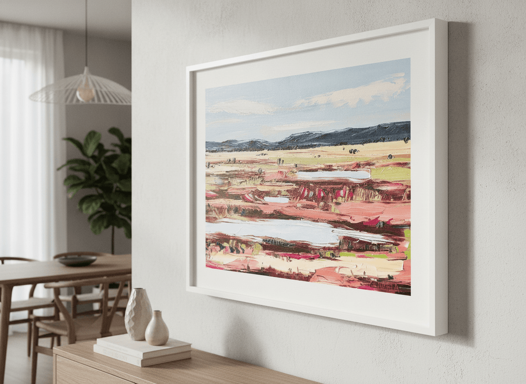 Wall art styled above a dining table in a contemporary home