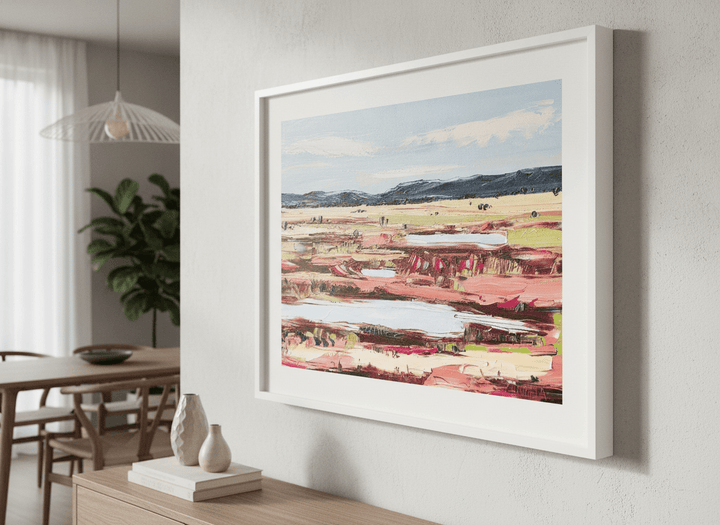 Wall art styled above a dining table in a contemporary home