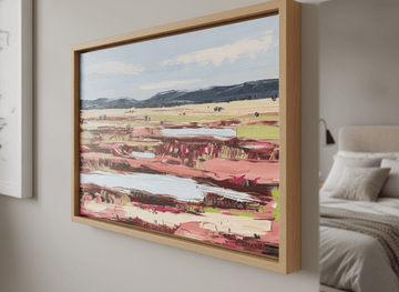 Minimalist artwork displayed in a calm, light-filled bedroom interior