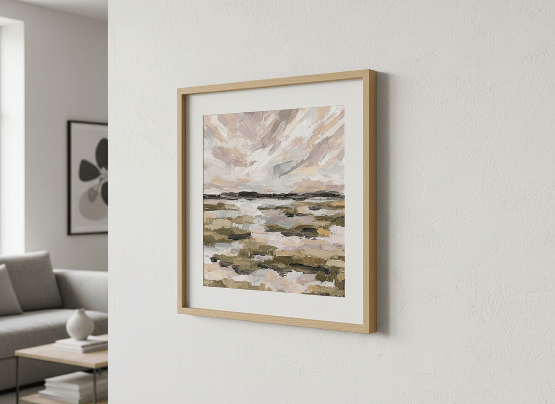 Modern wall art styled above a sofa in a neutral living room