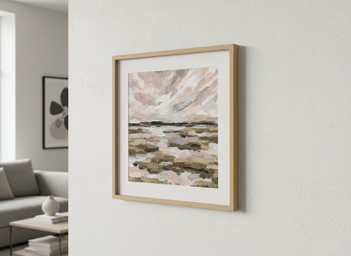 Modern wall art styled above a sofa in a neutral living room
