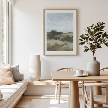 Modern living room with a painting, table, chairs, and decorative items.