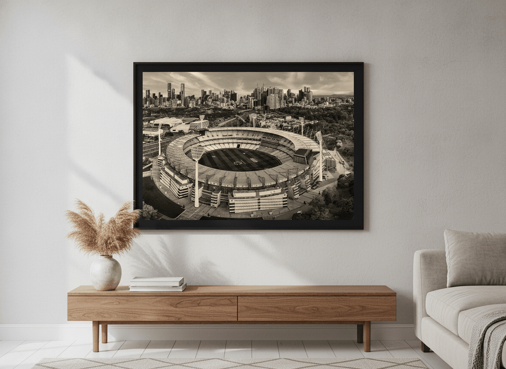 Modern wall art styled above a sofa in a neutral living room