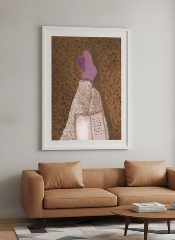 Modern wall art styled above a sofa in a neutral living room