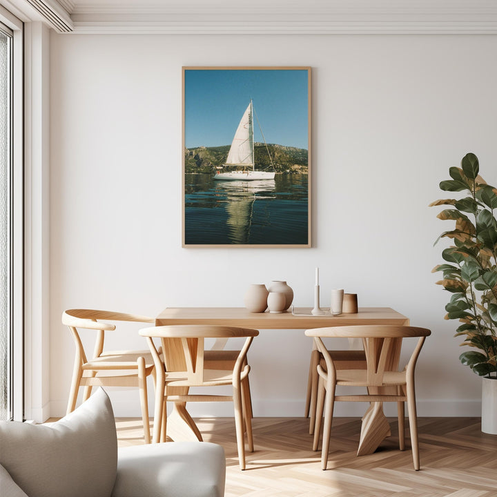 sailboat photo above dining table