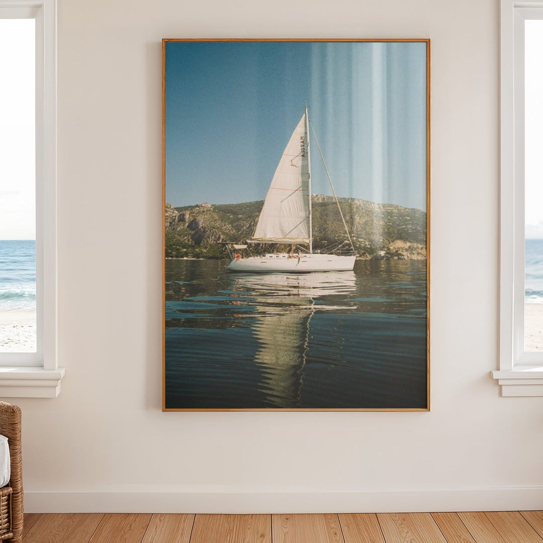 Sailboat photo on wall with wooden floor