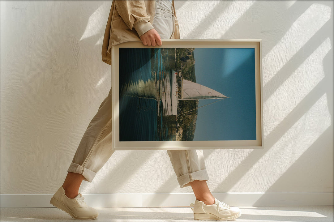 person walking holding sailboat photo