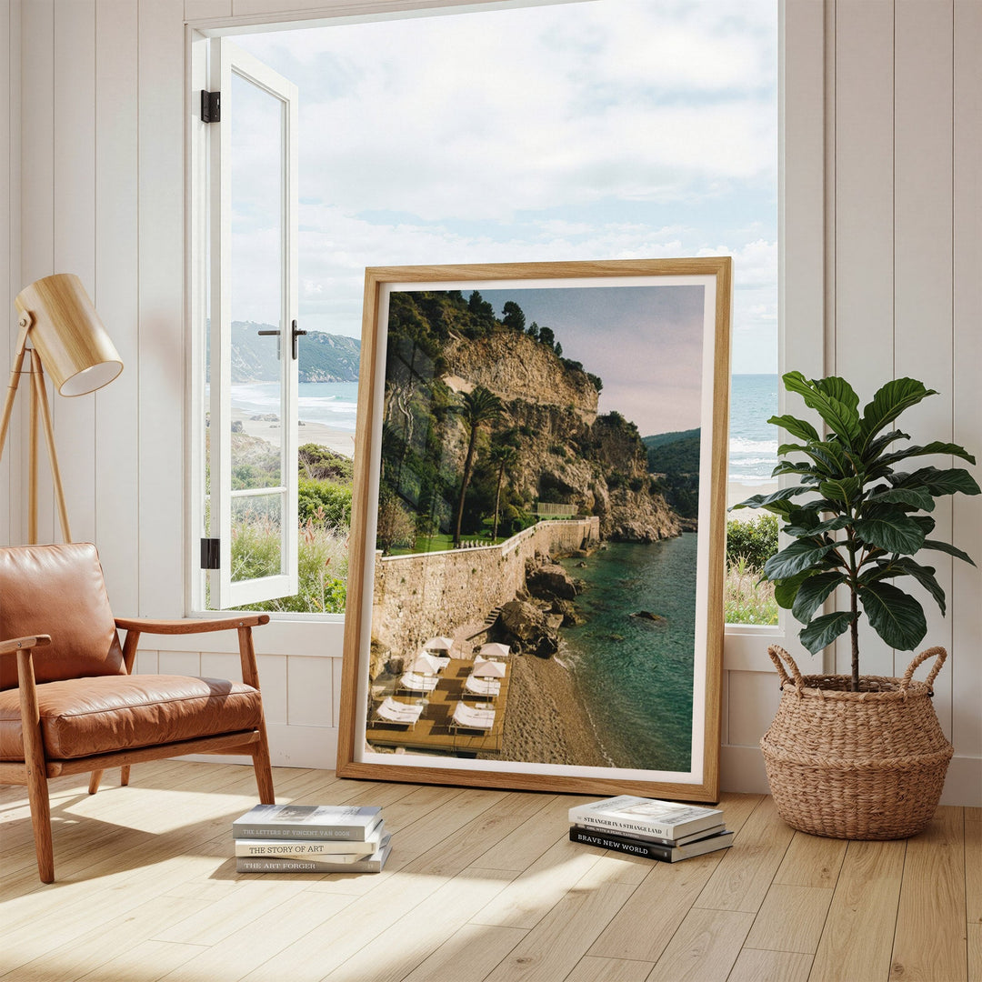 photo leaning on open window with potted plant on right and chair on left