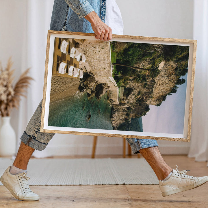 person walking holding photo