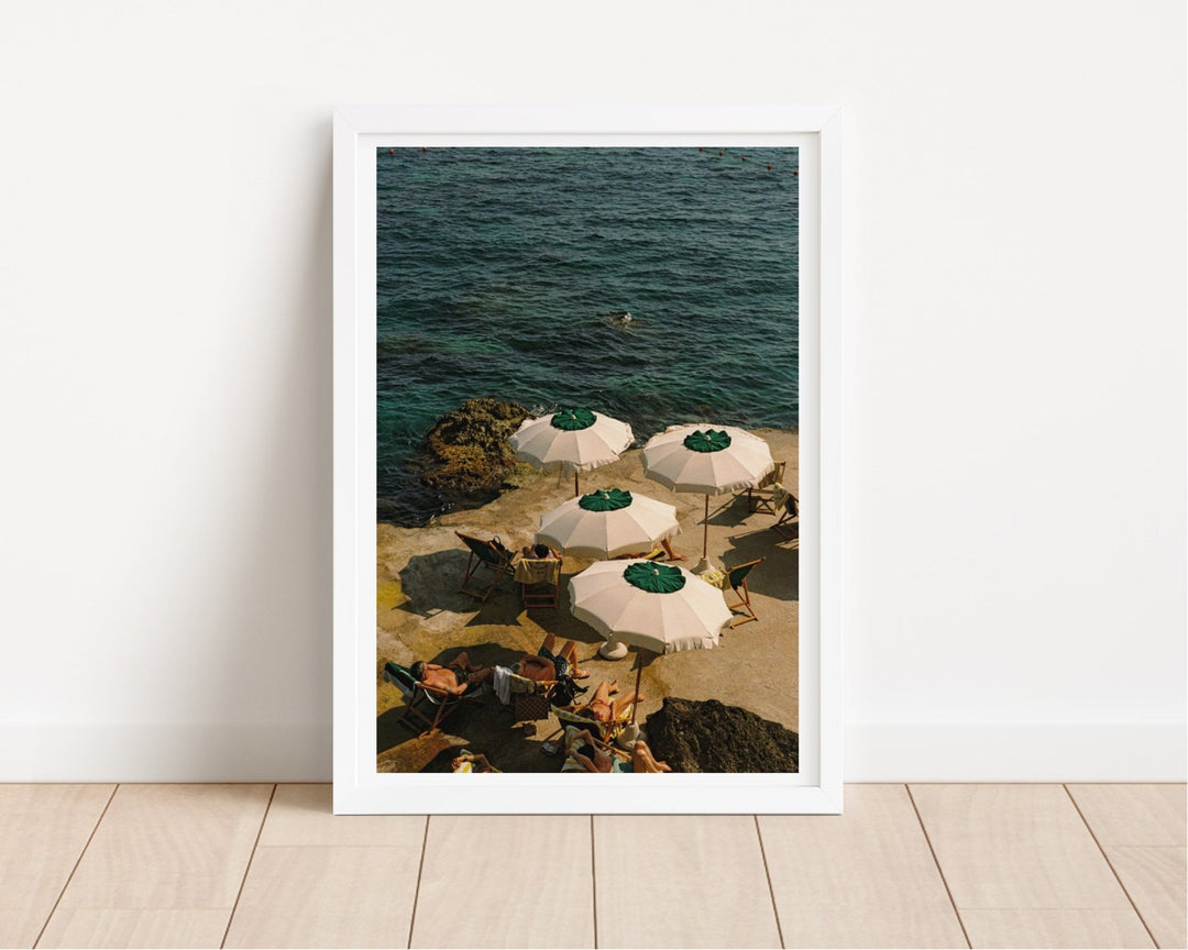 print on wooden floor leaning against white wall