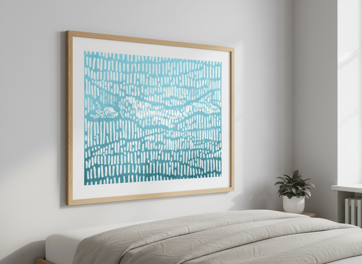 Minimalist artwork displayed in a calm, light-filled bedroom interior