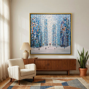Oversized statement canvas wall art with a gold leaf surround styled on the wall in a mid-century living room