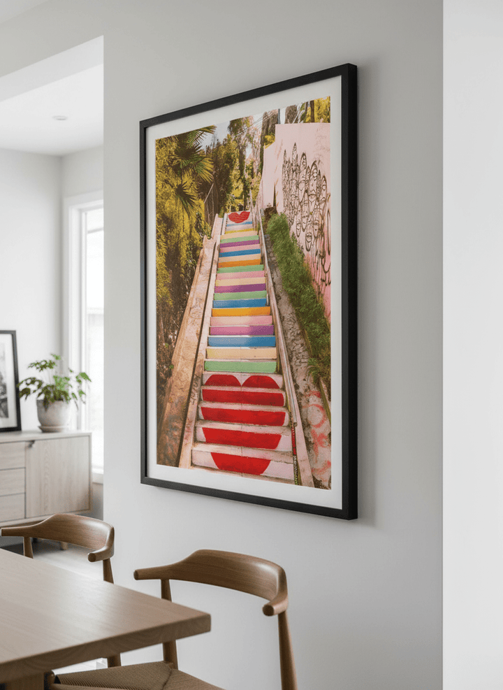 Wall art styled above a dining table in a contemporary home
