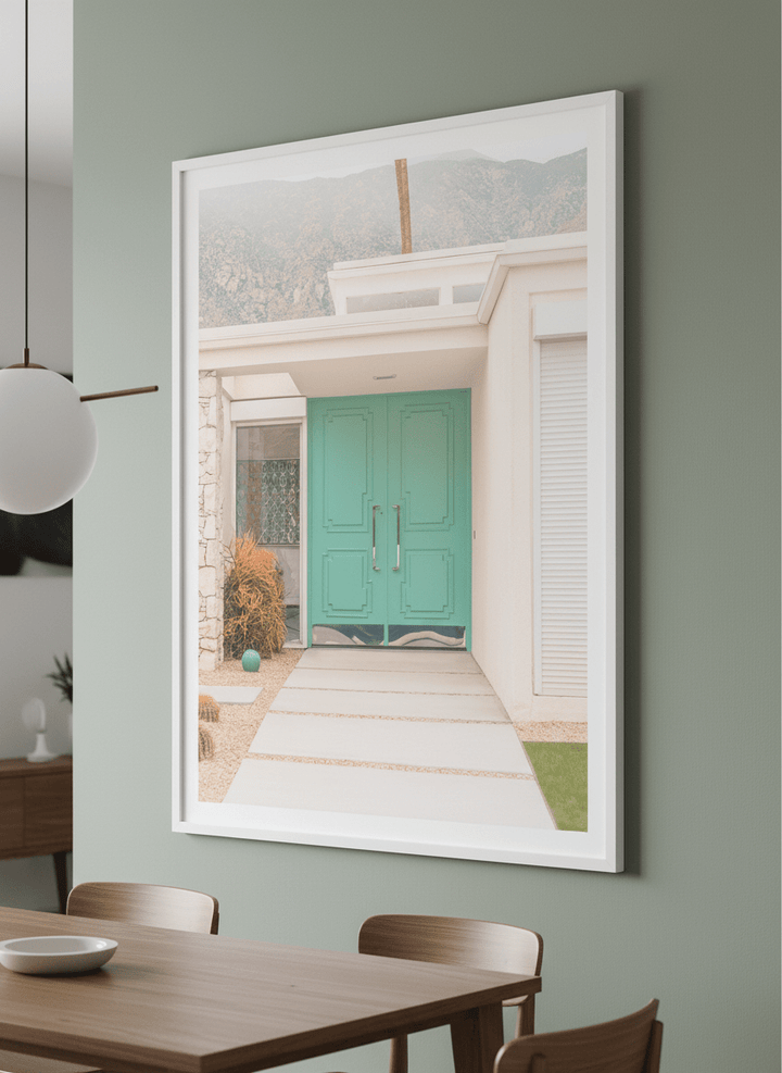 Wall art styled above a dining table in a contemporary home