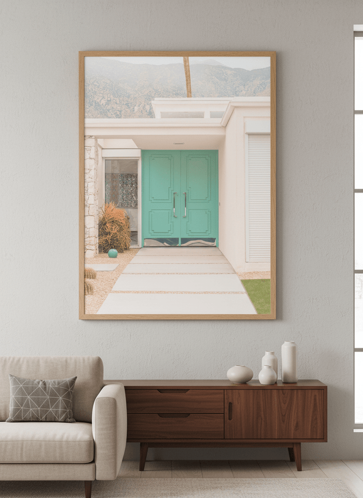 Modern wall art styled above a sofa in a neutral living room