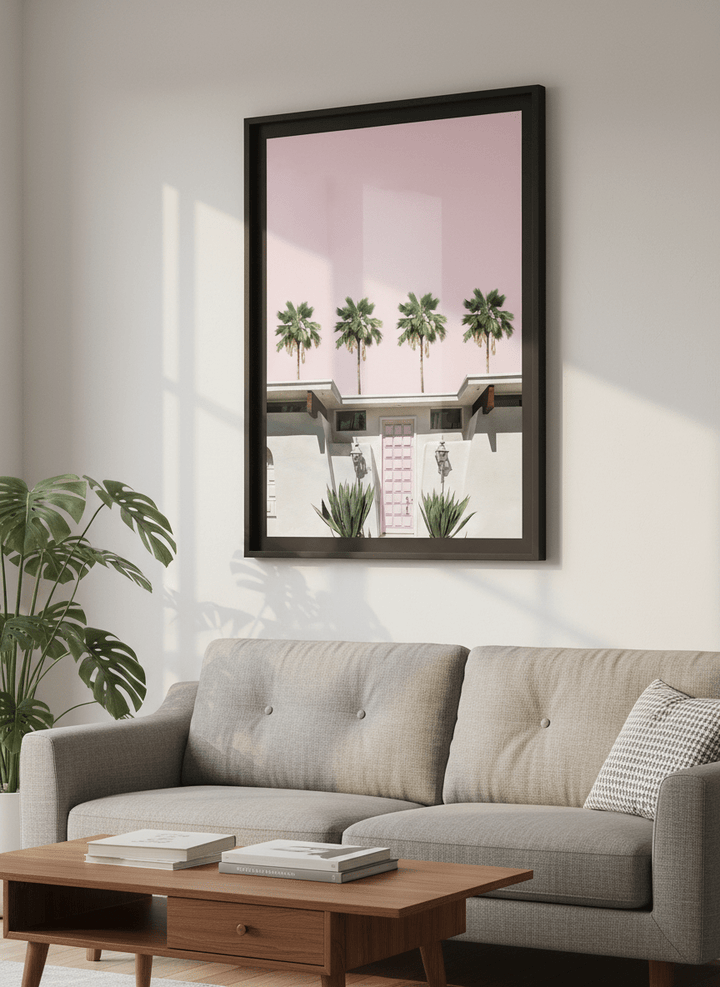 Modern wall art styled above a sofa in a neutral living room