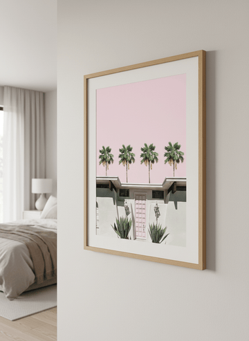 Minimalist artwork displayed in a calm, light-filled bedroom interior