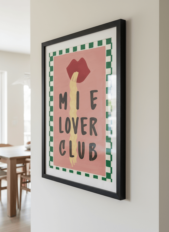Wall art styled above a dining table in a contemporary home