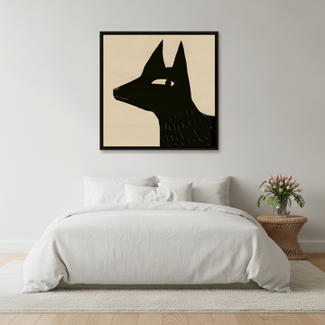 Canvas wall art with a black surround styled on the wall in a bright Scandinavian bedroom