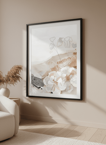 Modern wall art styled above a sofa in a neutral living room