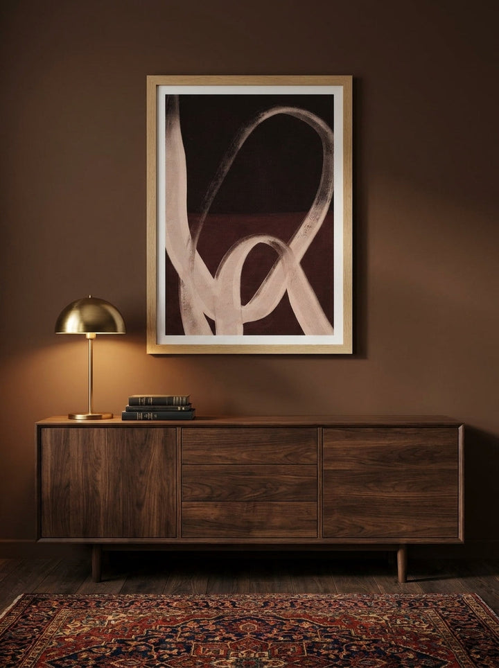 Modern wall art print styled on the wall in a moody living room