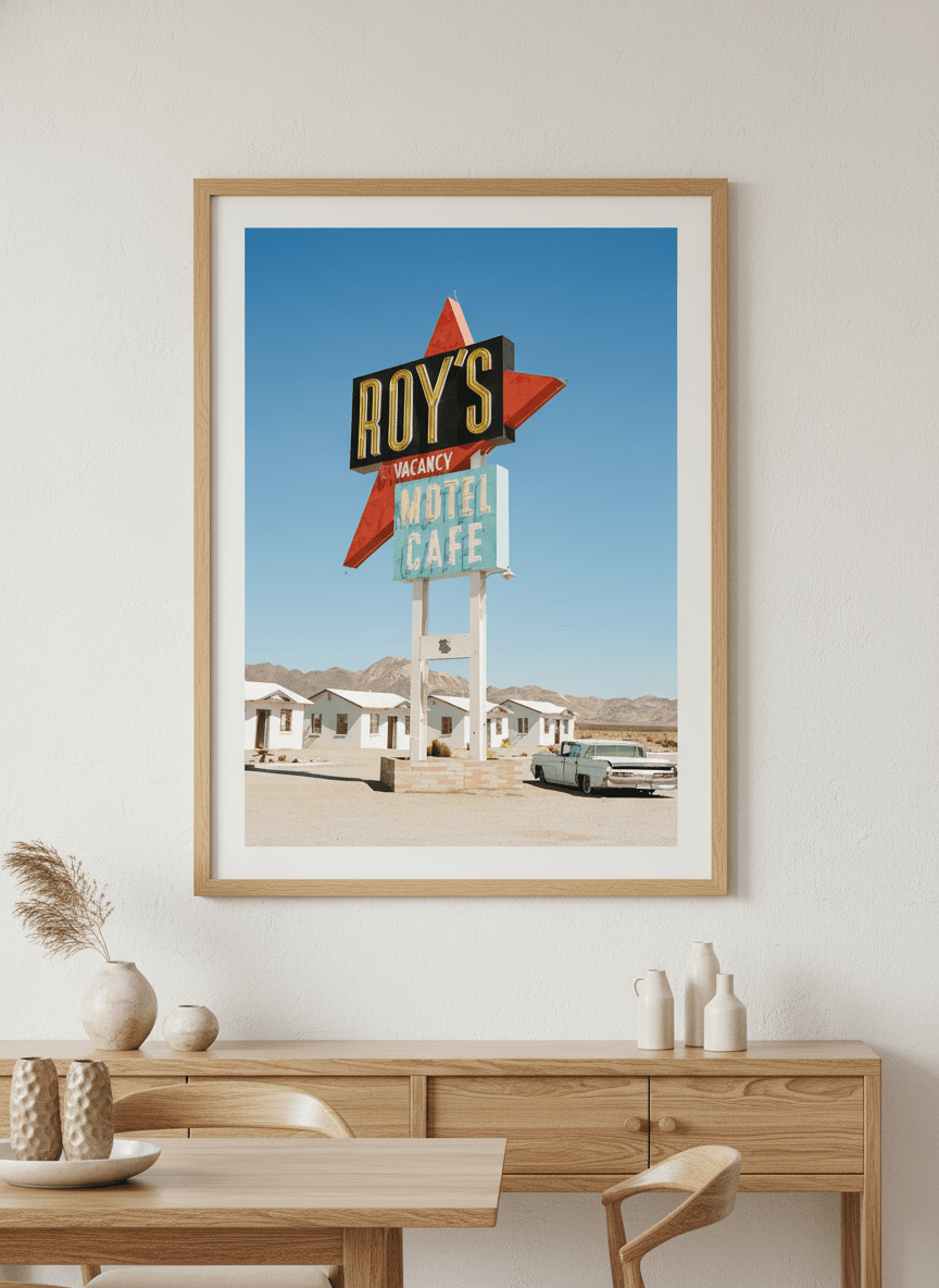 Wall art styled above a dining table in a contemporary home