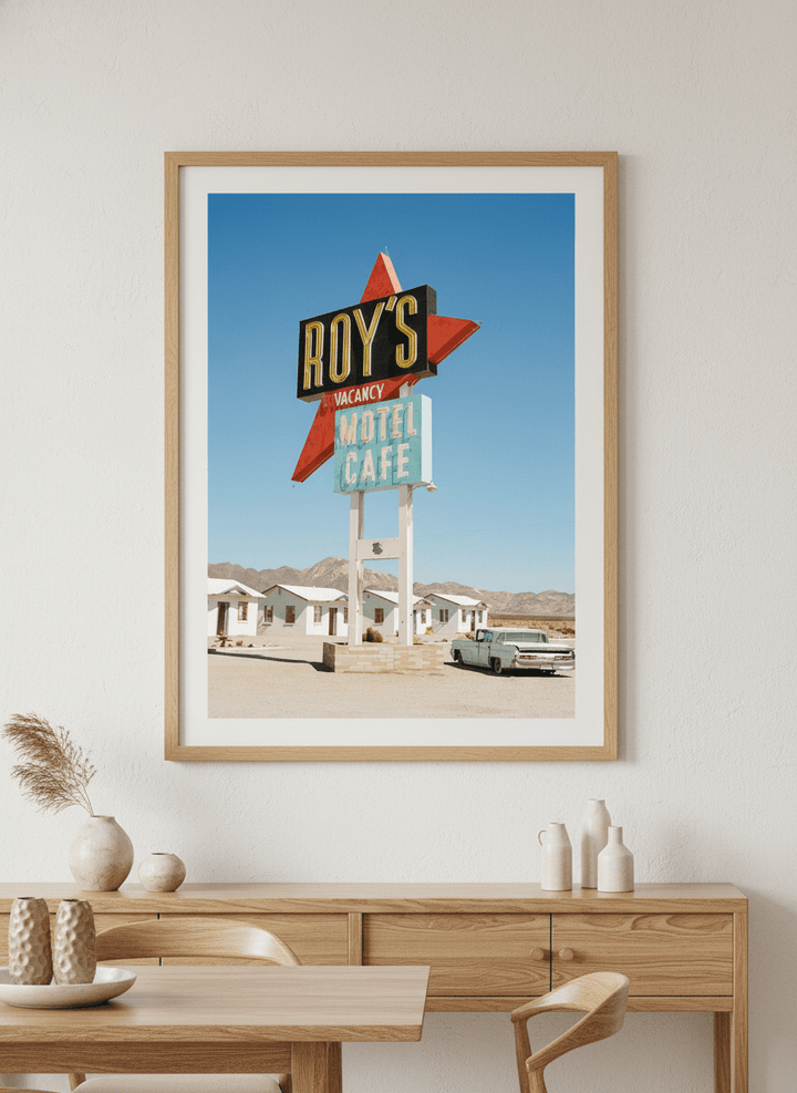 Wall art styled above a dining table in a contemporary home