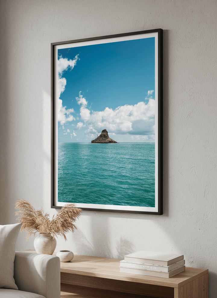 Modern wall art styled above a sofa in a neutral living room