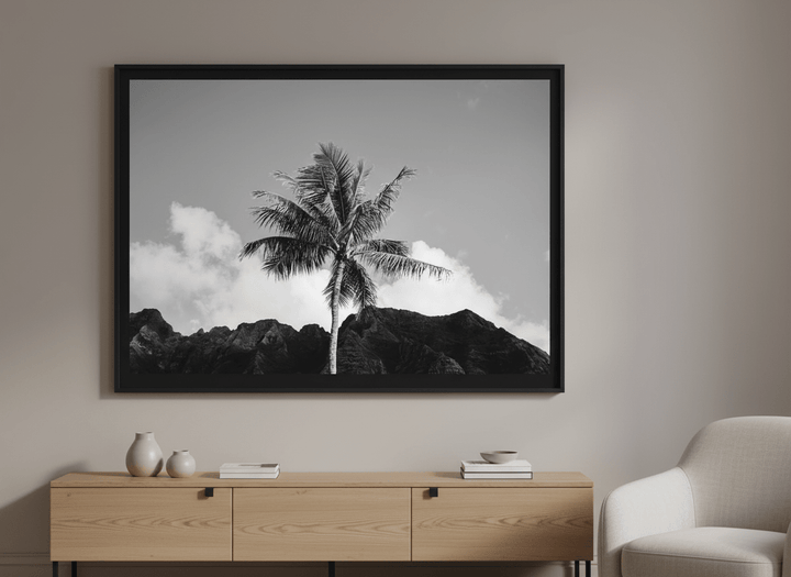 Modern wall art styled above a sofa in a neutral living room